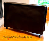 A black vinyl dust cover fitted over an Arturis Rackbrute 6U, with a note crediting the source of the image.