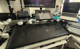A black vinyl dust cover for a Moog Muse synthesizer, displayed on a table with a laptop and other synthesizer components in the background, along with a thank you message for the pic.