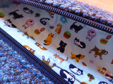 Turquoise Zipped Pouch with cats and dogs