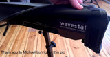 A black vinyl dust cover for a Korg Wavestate synth, featuring a velcro flap and labeled.
